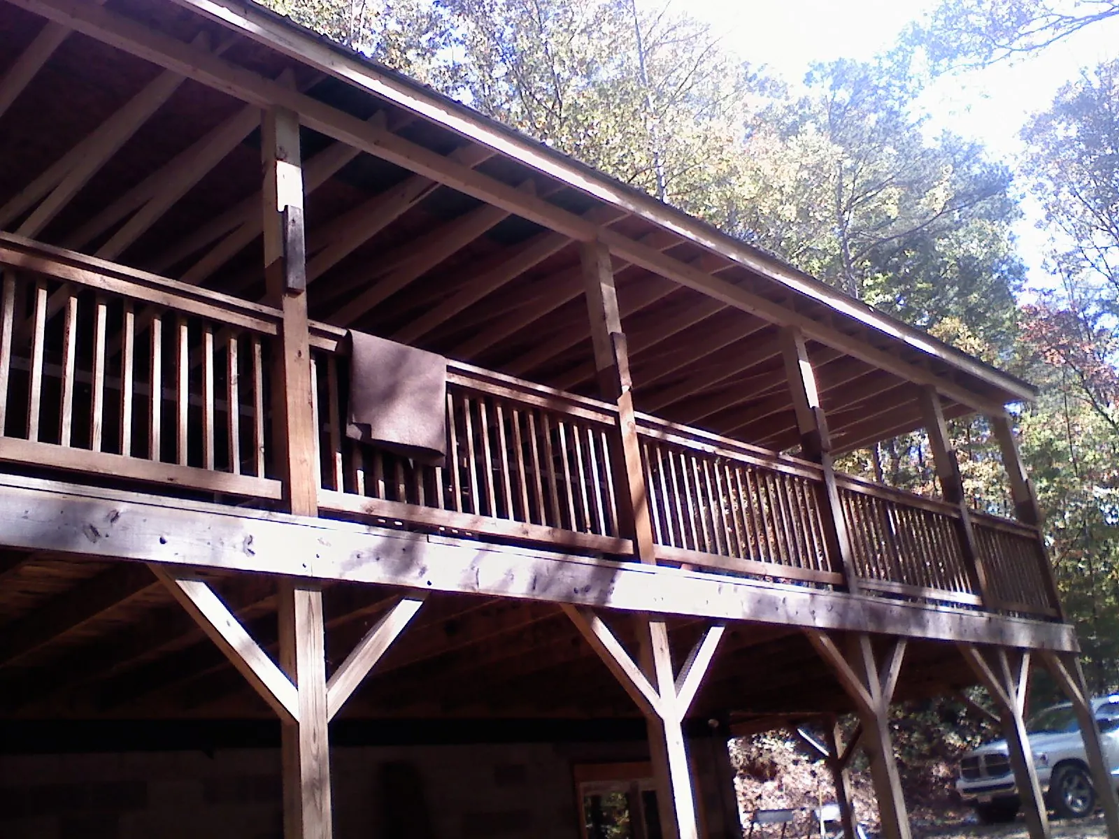 Timber framing under a new elevated porch and deck — Roof Leak Repair in Malone by Roofing Brothers